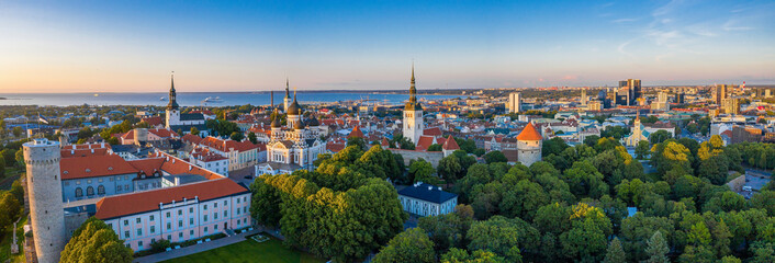 Wall Mural - Amazing aerial drone shot of old town of Tallinn, Estonia at sunset