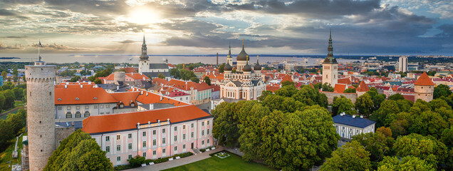 Wall Mural - Amazing aerial drone shot of old town of Tallinn, Estonia at sunset