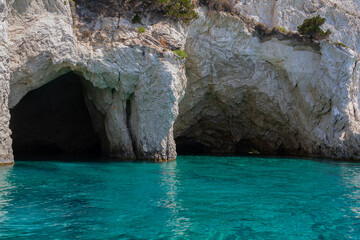 Wall Mural - Seascape - picturesque caves in the coastal cliffs and blue water