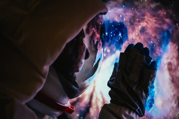 Wall Mural - astronaut looking deep space, galaxy and planets from the window of his capsule. concept about scien