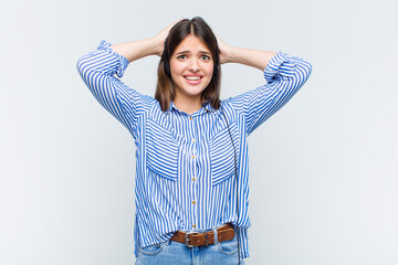 Wall Mural - pretty woman feeling stressed, worried, anxious or scared, with hands on head, panicking at mistake