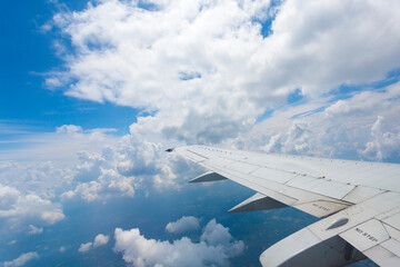 Airplane wing and clouds