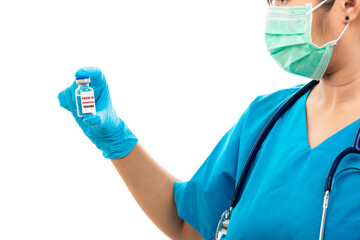 Female nurse with stethoscope puts on rubber gloves and wearing medical face mask, woman doctor in blue uniform holding COVID-19 vaccine, isolated on over white background, medical health concept