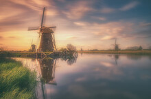 Traditional Windmill Against Sky During Sunset