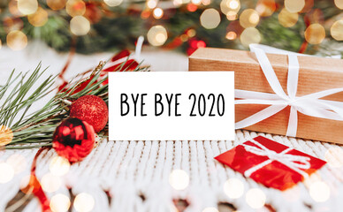 Merry christmas and merry new year concept with gift boxes and greeting card with text Bye bye 2020