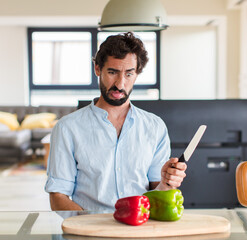 Wall Mural - bearded man feeling disgusted and irritated, sticking tongue out, disliking something nasty and yucky