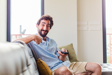 Sticker - bearded man feeling happy, surprised and proud, pointing to self with an excited, amazed look