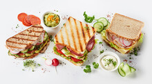 Trio Of Gourmet Sandwiches On Assorted Bread