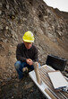 © SuperStock - Senior geologist studying core samples in a Quarry
