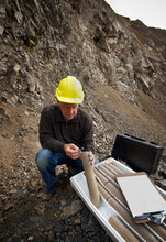  Senior Geologist Studying Core Samples In A Quarry