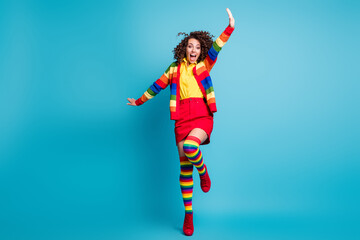 Poster - Full body photo of ecstatic cheerful curly hair girl happy fun hands fly plane isolated over blue color background