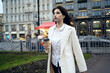 © Alex - woman  walking down the street with coffee