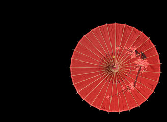 Chinese, Japanese, Oriental red umbrella on black background.