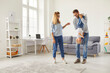 © Studio Romantic - Mom, dad and little son have fun at home, enjoying the weekend in the bright cozy living room.