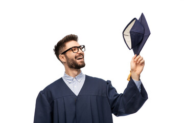 Poster - education, graduation and people concept - happy smiling male graduate student with mortar board and bachelor gown over white background