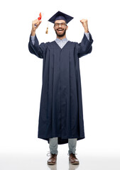 Poster - education, graduation and people concept - happy smiling male graduate student in mortar board and bachelor gown with diploma over grey background