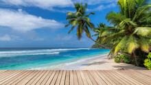 Paradise Sunny Beach With Wooden Floor, Palm Trees And The Turquoise Sea On Tropical Island.