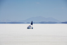Picnic Table On Uyuni Salt Lake In Bolivia With Mirage In Background
