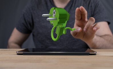 green power plug in hand