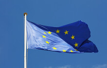 Low Angle View Of European Union Flag Against Blue Sky