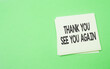 © ezuan - note paper written thank you and see you again over green background