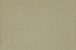 © Natalya - The texture of a natural simple fabric is light beige in a small cell. Cotton fabric background. Simple coarse cloth.