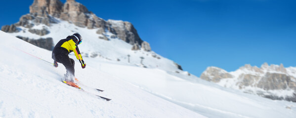 Wall Mural - Skier in Dolomites Alps mountains