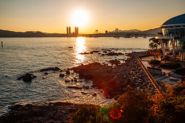 Wall Mural - Sunset view of Gwangan bridge and sea at Haeundae Dongbaekseom island in Busan, Korea