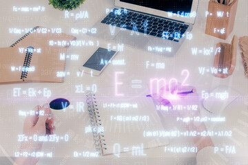 Science formula hologram over woman's hands taking notes background. Concept of study. Multi exposure