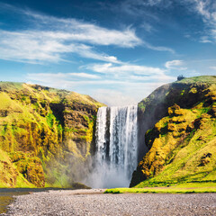 Wall Mural - Incredible view on famous Skogafoss waterfall on Skoga river. Iceland, Europe. Landscape photography