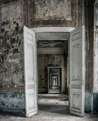 A long corridor of rooms with open doors in an old abandoned scary manor. A window in the distance. Shabby walls, ancient architecture. Vintage doors.