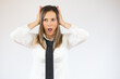 © Danko - Portrait of surprised business woman holding tablet on white background