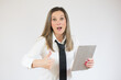 © Danko - Portrait of surprised business woman holding tablet on white background