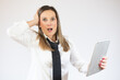 © Danko - Portrait of surprised business woman holding tablet on white background