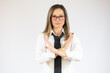 © Danko - Beautiful young business woman over isolated background Rejection expression crossing arms doing negative sign, angry face