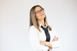 © Danko - Young business woman over isolated white background looking to the side.