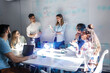 © BalanceFormCreative - Team leader and his programmers in conference room.They discussing about development of new project.