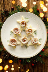 Wall Mural - Herring fillets on a plate, top view. Traditional Christmas Eve dish