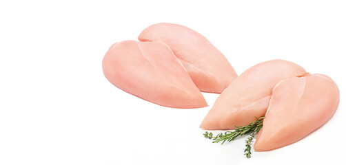 farm chicken fillet with rosemary and thyme sprigs, not cooked on a white background.