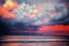 Scenic View Of Sea Against Dramatic Sky