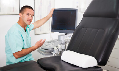 Portrait of young man hospital doctor in cabinet of ultrasound test