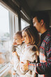 © MeganBetteridge - Young Couple at home Playing with Baby