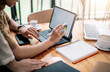 © amnaj - Close Up . Hands of woman designer using digital tablet to work at home or in the office.