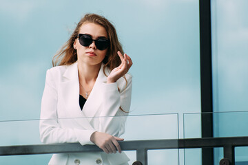 Wall Mural - Portrait of a woman in sunglasses glasses.