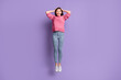 © deagreez - Full length body size photo of jumping high amazed surprised woman touching head isolated on bright purple color background