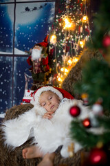 Sticker - Beautiful toddler child, baby boy, sleeping on Christmas eve at home