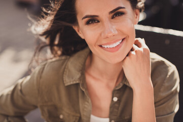 Sticker - Photo portrait of dreamy woman sitting in cafe outdoors smiling touching neck