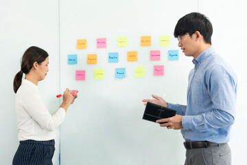 Poster - business teamwork in meeting and adhesive stick note on mirror board discussting with team in office room for collecting some idea brainstorming plan.