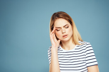 Wall Mural - Emotional woman striped t-shirt lifestyle cropped blue background 