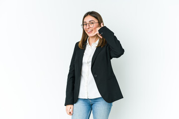 Young caucasian business woman showing a mobile phone call gesture with fingers.